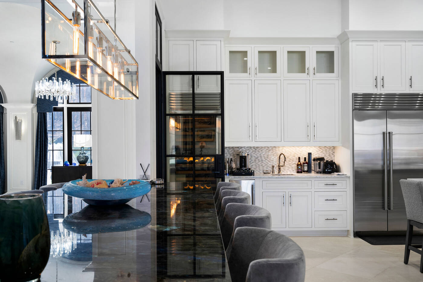 Luxury kitchen renovation by Vision Luxury Residential with black-framed glass cabinetry